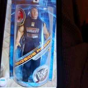 WWE Ringside Rebel Figure in Black and Blue Packaging